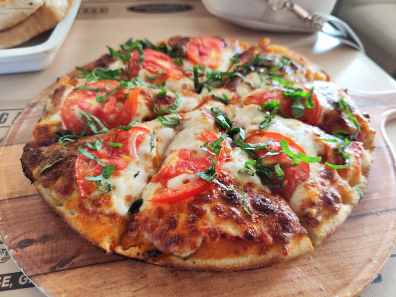 Marco's pizza freshly made at Marcos Restaurant kitchen
